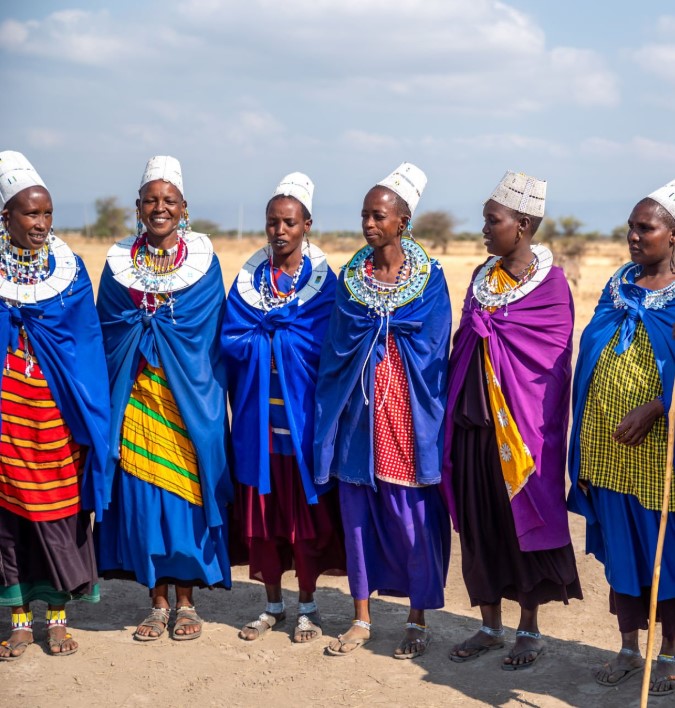 Maasai warriors performing traditional dance in the open plains of the Masai Mara.