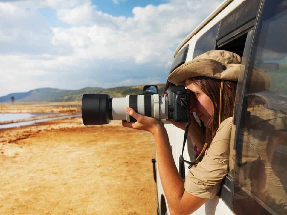 How do I protect my gear from dust during game drives?