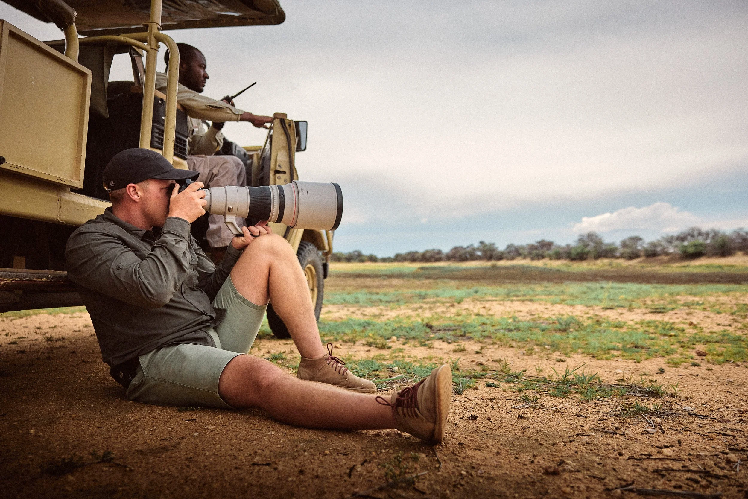 How do I protect my gear from dust during game drives?