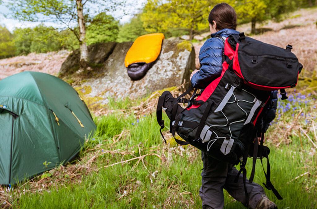 What is the difference between backpacking and hiking?